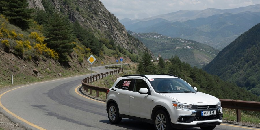 Mitsubishi ASX a noleggio su una strada di montagna in Georgia