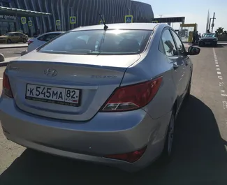 Noleggio auto Hyundai Solaris 2015 in Crimea, con carburante Benzina e 123 cavalli di potenza ➤ A partire da 2000 RUB al giorno.