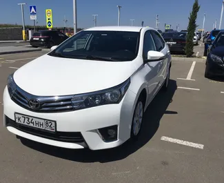 Vista frontale di un noleggio Toyota Corolla all'aeroporto di Simferopol, Crimea ✓ Auto #1402. ✓ Cambio Automatico TM ✓ 0 recensioni.