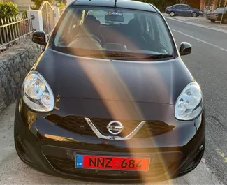 Vista frontale di un noleggio Nissan March a Pomos, Cipro ✓ Auto #4000. ✓ Cambio Automatico TM ✓ 0 recensioni.