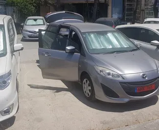 Vista frontale di un noleggio Mazda Premacy a Limassol, Cipro ✓ Auto #3890. ✓ Cambio Automatico TM ✓ 0 recensioni.