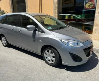 Vista frontale di un noleggio Mazda Premacy a Larnaca, Cipro ✓ Auto #4379. ✓ Cambio Automatico TM ✓ 0 recensioni.