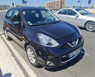 Vista frontale di un noleggio Nissan Micra a Tirana, Albania ✓ Auto #4513. ✓ Cambio Automatico TM ✓ 0 recensioni.