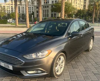 Vista frontale di un noleggio Ford Fusion Sedan a Dubai, Emirati Arabi Uniti ✓ Auto #4866. ✓ Cambio Automatico TM ✓ 0 recensioni.