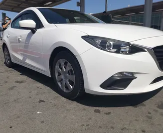 Noleggio auto Mazda Axela 2015 a Cipro, con carburante Benzina e 60 cavalli di potenza ➤ A partire da 40 EUR al giorno.