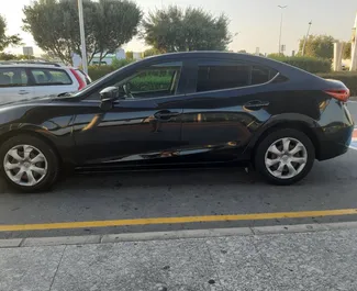 Vista frontale di un noleggio Mazda Axela a Larnaca, Cipro ✓ Auto #785. ✓ Cambio Automatico TM ✓ 0 recensioni.