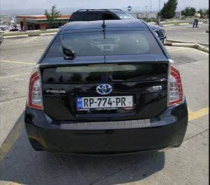 Noleggio auto Toyota Prius 2013 in Georgia, con carburante Ibrido e 134 cavalli di potenza ➤ A partire da 78 GEL al giorno.