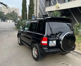 Noleggio auto Mitsubishi Pajero Io 2004 in Georgia, con carburante Benzina e 130 cavalli di potenza ➤ A partire da 95 GEL al giorno.