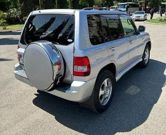 Noleggio auto Mitsubishi Pajero Io 2006 in Georgia, con carburante Benzina e 130 cavalli di potenza ➤ A partire da 100 GEL al giorno.