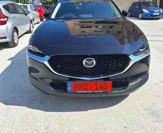 Vista frontale di un noleggio Mazda CX-30 a Limassol, Cipro ✓ Auto #7233. ✓ Cambio Automatico TM ✓ 0 recensioni.