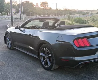 Ford Mustang Cabrio 2017 disponibile per il noleggio a Tbilisi, con limite di chilometraggio di illimitato.