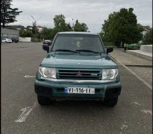 Vista frontale di un noleggio Mitsubishi Pajero Io a Kutaisi, Georgia ✓ Auto #7748. ✓ Cambio Automatico TM ✓ 1 recensioni.