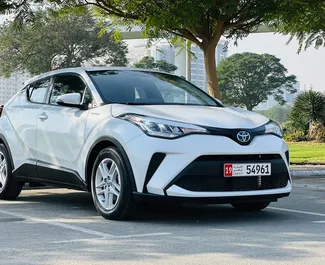 Noleggio auto Toyota C-HR 2023 negli Emirati Arabi Uniti, con carburante Ibrido e 160 cavalli di potenza ➤ A partire da 110 AED al giorno.