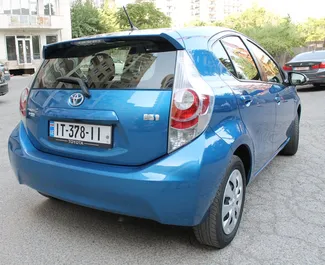 Noleggio auto Toyota Prius C 2013 in Georgia, con carburante Ibrido e 99 cavalli di potenza ➤ A partire da 73 GEL al giorno.