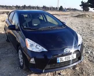 Noleggio auto Toyota Prius C 2014 in Georgia, con carburante Benzina e 99 cavalli di potenza ➤ A partire da 78 GEL al giorno.