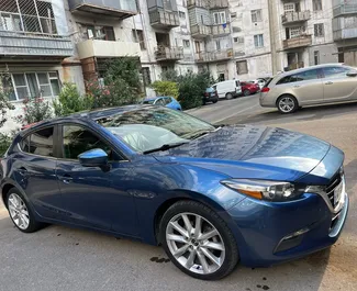 Vista frontale di un noleggio Mazda 3 a Tbilisi, Georgia ✓ Auto #9529. ✓ Cambio Automatico TM ✓ 0 recensioni.