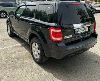 Ford Escape 2010 disponibile per il noleggio a Tbilisi, con limite di chilometraggio di illimitato.