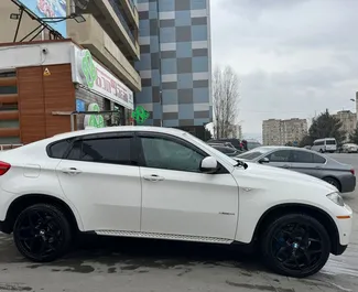 Noleggio auto BMW X6 2011 in Georgia, con carburante Benzina e 360 cavalli di potenza ➤ A partire da 400 GEL al giorno.