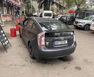 Noleggio auto Toyota Prius 2014 in Georgia, con carburante Ibrido e 96 cavalli di potenza ➤ A partire da 62 GEL al giorno.