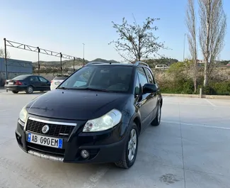 Vista frontale di un noleggio Fiat Sedici a Tirana, Albania ✓ Auto #9999. ✓ Cambio Manuale TM ✓ 0 recensioni.