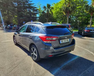 Interni di Subaru Impreza in affitto in Georgia. Un'ottima auto da 5 posti con cambio Automatico.