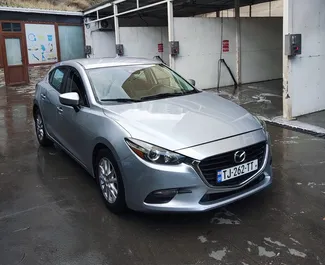 Vista frontale di un noleggio Mazda 3 a Tbilisi, Georgia ✓ Auto #11093. ✓ Cambio Automatico TM ✓ 0 recensioni.