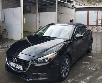 Vista frontale di un noleggio Mazda 3 a Tbilisi, Georgia ✓ Auto #11062. ✓ Cambio Automatico TM ✓ 0 recensioni.