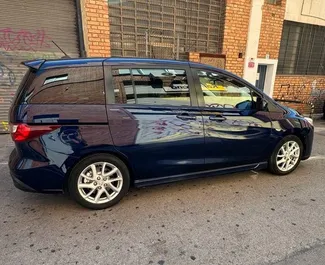 Vista frontale di un noleggio Mazda 5 a Valencia, Spagna ✓ Auto #11036. ✓ Cambio Manuale TM ✓ 0 recensioni.