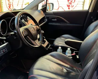 Noleggio Mazda 5. Auto Comfort, Monovolume per il noleggio in Spagna ✓ Cauzione di Deposito di 400 EUR ✓ Opzioni assicurative RCT, Furto, All'estero.