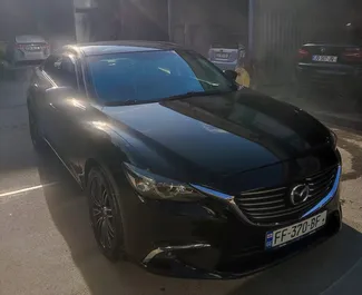 Vista frontale di un noleggio Mazda 6 a Tbilisi, Georgia ✓ Auto #12498. ✓ Cambio Automatico TM ✓ 0 recensioni.