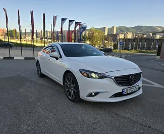 Vista frontale di un noleggio Mazda 6 a Tbilisi, Georgia ✓ Auto #13407. ✓ Cambio Automatico TM ✓ 0 recensioni.