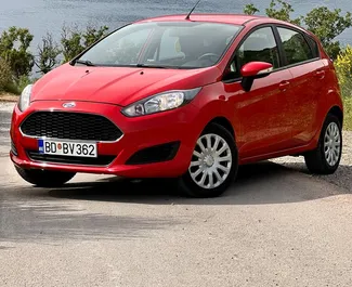 Vista frontale di un noleggio Ford Fiesta Ecoboost a Budva, Montenegro ✓ Auto #12505. ✓ Cambio Automatico TM ✓ 0 recensioni.