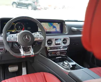 Noleggio Mercedes-Benz G63 AMG. Auto Premium, Lusso, SUV per il noleggio negli Emirati Arabi Uniti ✓ Cauzione di Deposito di 2500 AED ✓ Opzioni assicurative RCT.