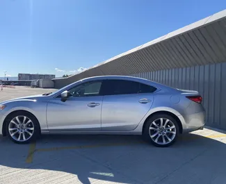 Vista frontale di un noleggio Mazda 6 a Tbilisi, Georgia ✓ Auto #13413. ✓ Cambio Automatico TM ✓ 0 recensioni.