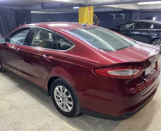 Ford Fusion Sedan 2015 disponibile per il noleggio a Tbilisi, con limite di chilometraggio di illimitato.
