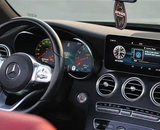 Noleggio auto Mercedes-Benz C300 Cabrio 2022 negli Emirati Arabi Uniti, con carburante Benzina e 255 cavalli di potenza ➤ A partire da 425 AED al giorno.