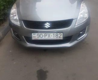 Vista frontale di un noleggio Suzuki Swift a Baku, Azerbaigian ✓ Auto #13498. ✓ Cambio Automatico TM ✓ 0 recensioni.