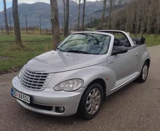 Vista frontale di un noleggio Chrysler PT Cruiser Сabrio a Budva, Montenegro ✓ Auto #4141. ✓ Cambio Automatico TM ✓ 0 recensioni.