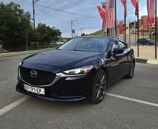 Vista frontale di un noleggio Mazda 6 a Tbilisi, Georgia ✓ Auto #13520. ✓ Cambio Automatico TM ✓ 0 recensioni.