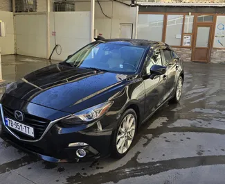 Vista frontale di un noleggio Mazda 3 a Tbilisi, Georgia ✓ Auto #14066. ✓ Cambio Automatico TM ✓ 0 recensioni.