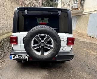 Noleggio Jeep Wrangler Sahara. Auto Comfort, SUV, Cabrio per il noleggio in Georgia ✓ Cauzione di Senza deposito ✓ Opzioni assicurative RCT, SCDW, FDW, Passeggeri.