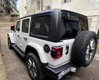 Noleggio auto Jeep Wrangler Sahara 2021 in Georgia, con carburante Benzina e 270 cavalli di potenza ➤ A partire da 239 GEL al giorno.