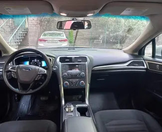 Ford Fusion Sedan 2020 disponibile per il noleggio a Tbilisi, con limite di chilometraggio di illimitato.