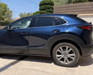 Noleggio Mazda CX-30. Auto Economica, Comfort, Crossover per il noleggio in Spagna ✓ Cauzione di Deposito di 500 EUR ✓ Opzioni assicurative RCT.