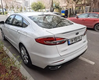 Noleggio auto Ford Fusion Sedan 2019 in Georgia, con carburante Ibrido e 188 cavalli di potenza ➤ A partire da 140 GEL al giorno.