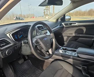 Noleggio Ford Fusion Sedan. Auto Comfort per il noleggio in Georgia ✓ Cauzione di Senza deposito ✓ Opzioni assicurative RCT, CDW, Senza deposito.