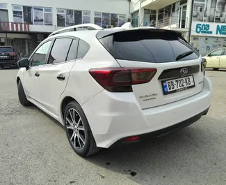 Vista frontale di un noleggio Subaru Impreza a Tbilisi, Georgia ✓ Auto #15458. ✓ Cambio Automatico TM ✓ 0 recensioni.