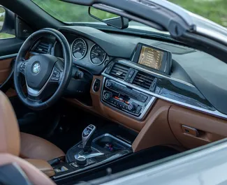 Interni di BMW 428i Cabrio in affitto in Montenegro. Un'ottima auto da 5 posti con cambio Automatico.