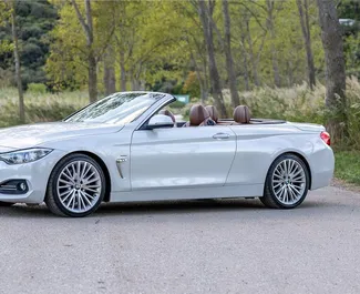 Vista frontale di un noleggio BMW 428i Cabrio in Becici, Montenegro ✓ Auto #2476. ✓ Cambio Automatico TM ✓ 0 recensioni.