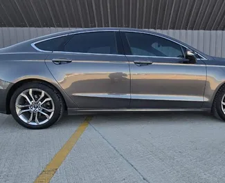 Noleggio auto Ford Fusion Sedan 2020 in Georgia, con carburante Ibrido e 180 cavalli di potenza ➤ A partire da 75 GEL al giorno.